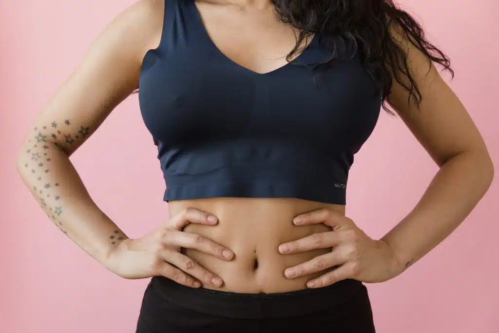 Woman in Blue Sports Bra and Black Bottoms